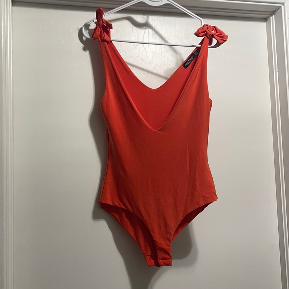 orange bodysuit